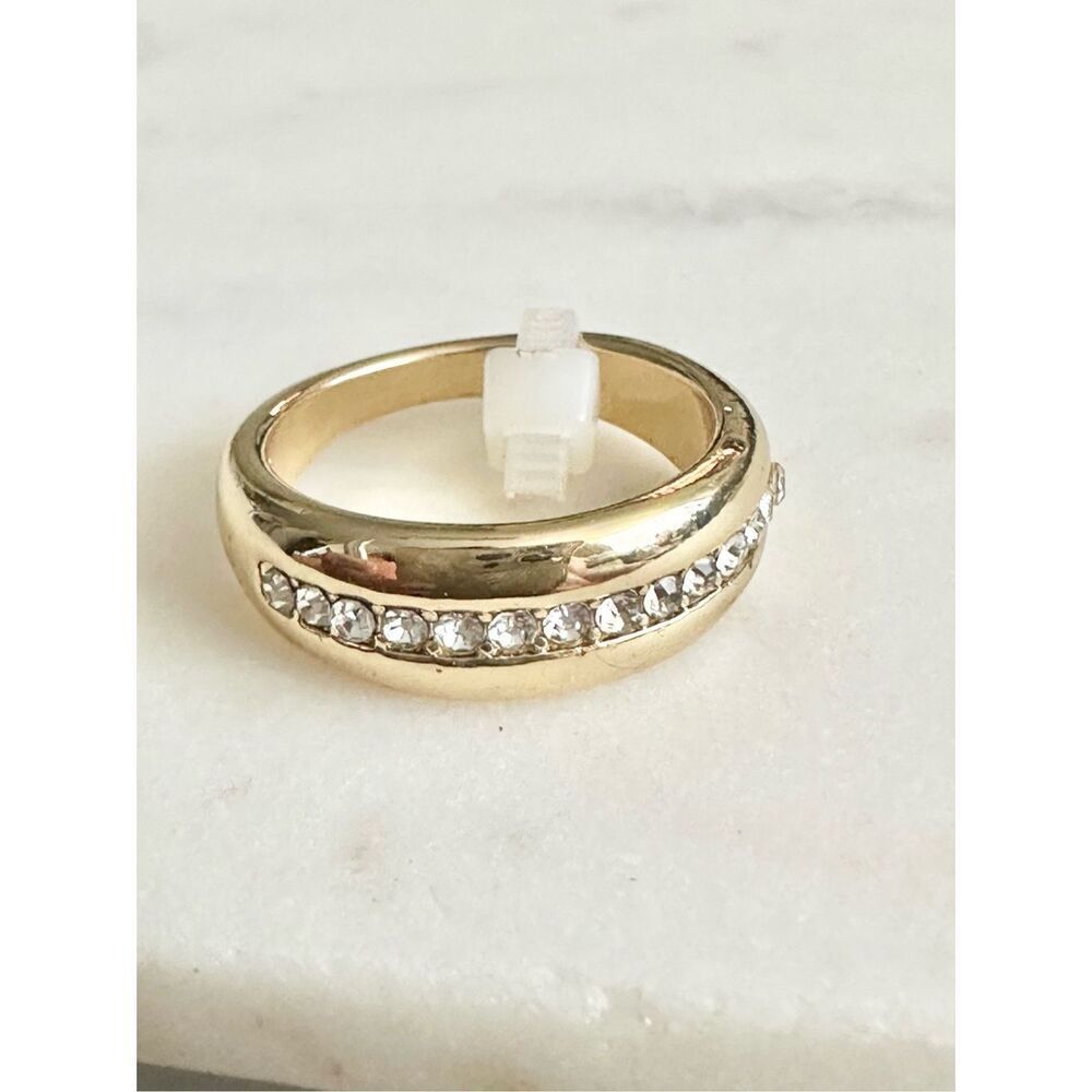 Sleek gold color ring with rhinestones size 6￼